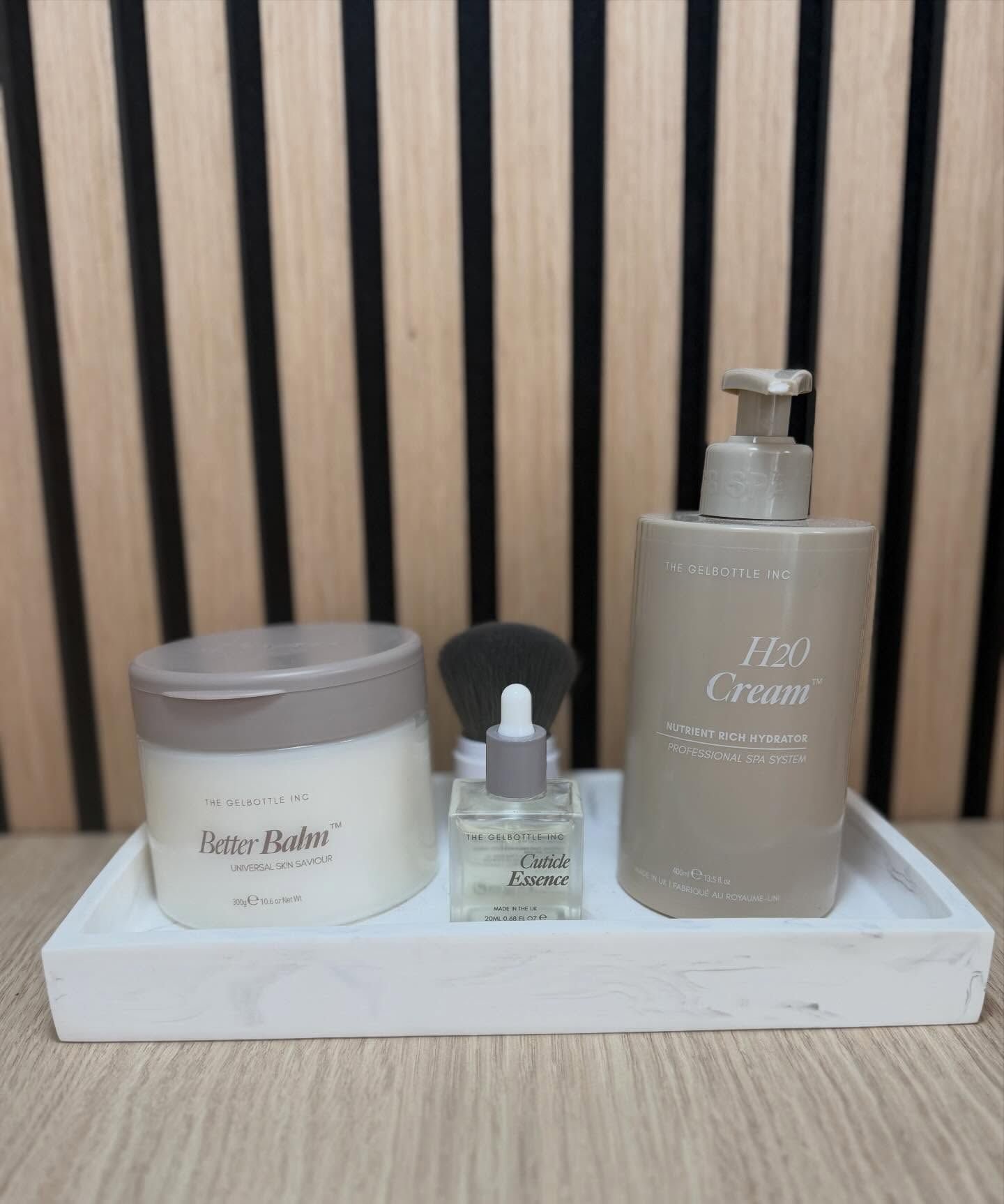 Hand cream, cuticle oil and balm on the studio desk